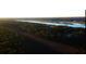 Scenic aerial view of waterfront property with marsh and houses at 1461 Jeremy Cay Ct # 110, Awendaw, SC 29429