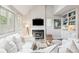 Cozy living room with white slipcovered furniture and a fireplace at 933 Mccants Dr, Mount Pleasant, SC 29464