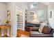 Home office with built-in shelving, wood floors, and a workspace at 933 Mccants Dr, Mount Pleasant, SC 29464