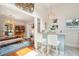 Open dining area with hardwood floors and a rustic wooden table at 933 Mccants Dr, Mount Pleasant, SC 29464
