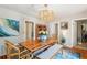 Bright dining room with wooden table, rattan chairs, and blue rug at 933 Mccants Dr, Mount Pleasant, SC 29464