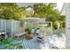 Private backyard patio with comfortable seating and a gas grill at 933 Mccants Dr, Mount Pleasant, SC 29464