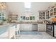 Well-equipped kitchen with white cabinets and skylight at 933 Mccants Dr, Mount Pleasant, SC 29464