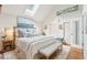 Bright and airy primary bedroom with a king-size bed and a sitting area at 933 Mccants Dr, Mount Pleasant, SC 29464