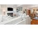Spacious living room featuring white slipcovered sofas and a fireplace at 933 Mccants Dr, Mount Pleasant, SC 29464