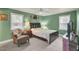 Bedroom with green walls, a comfy chair, and a double bed at 1510 Jahnz Ave, Summerville, SC 29485