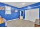 A blue-walled game room with a dartboard and built-in closet at 1510 Jahnz Ave, Summerville, SC 29485