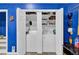A bright laundry room with washer, dryer, and extra storage at 1510 Jahnz Ave, Summerville, SC 29485