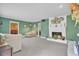 Living room with fireplace, green walls, and neutral carpet at 1510 Jahnz Ave, Summerville, SC 29485