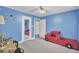 A blue bedroom with a red truck bed and a full-length mirror at 1510 Jahnz Ave, Summerville, SC 29485