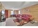 Gathering room with wood walls, red leather furniture, and game table at 1510 Jahnz Ave, Summerville, SC 29485