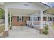 Covered carport with brick columns and access to front porch at 1510 Jahnz Ave, Summerville, SC 29485