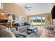 Spacious living area featuring hardwood floors, large windows, and comfortable seating at 2473 High Hammock Rd, Seabrook Island, SC 29455