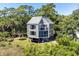 Unique two-story home with metal roof and deck at 2473 High Hammock Rd, Seabrook Island, SC 29455