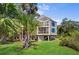Elevated home with a spacious yard and screened porch at 2473 High Hammock Rd, Seabrook Island, SC 29455