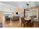 Open dining area with hardwood floors and access to deck at 2473 High Hammock Rd, Seabrook Island, SC 29455