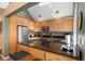 Updated kitchen featuring wood cabinets, granite countertops, and stainless steel appliances at 2473 High Hammock Rd, Seabrook Island, SC 29455