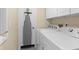 Convenient laundry room with washer and dryer, and ample storage at 2473 High Hammock Rd, Seabrook Island, SC 29455