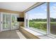 Relaxing sitting area with large windows offering stunning golf course views at 2473 High Hammock Rd, Seabrook Island, SC 29455
