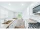 Open concept kitchen with granite countertops and stainless steel appliances at 756 Long Bluff Rd, Summerville, SC 29486