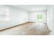 Spacious living room with wood-look flooring and sliding glass door at 756 Long Bluff Rd, Summerville, SC 29486