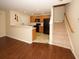 Living room with dark hardwood floors and kitchen view at 2429 Scholar Ln, North Charleston, SC 29406