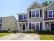 Tan two-story home with dark shutters and landscaping at 2429 Scholar Ln, North Charleston, SC 29406