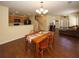 Bright dining room features hardwood floors and a charming wooden table with seating for four at 2429 Scholar Ln, North Charleston, SC 29406