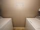 Laundry room with washer and dryer and neutral colored walls at 2429 Scholar Ln, North Charleston, SC 29406