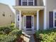 Two-story home with a covered entryway and well-manicured landscaping at 2429 Scholar Ln, North Charleston, SC 29406