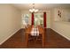 Dining room with hardwood floors, a table for four, and access to a backyard at 2429 Scholar Ln, North Charleston, SC 29406