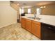 Kitchen with black appliances, light wood cabinets, and tile flooring at 2429 Scholar Ln, North Charleston, SC 29406