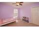 Twin bed in a light purple room with a closet at 2429 Scholar Ln, North Charleston, SC 29406