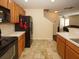 Kitchen with black appliances, light wood cabinets, and tile flooring at 2429 Scholar Ln, North Charleston, SC 29406