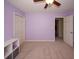 Light purple-walled bedroom with double doors and closet at 2429 Scholar Ln, North Charleston, SC 29406