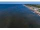 Aerial view of beach and oceanfront homes at 144 Palmetto Blvd, Edisto Island, SC 29438