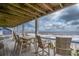 Oceanfront deck with table and chairs, perfect for enjoying the view at 144 Palmetto Blvd, Edisto Island, SC 29438