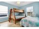 Bedroom with twin and full beds, and light blue walls at 144 Palmetto Blvd, Edisto Island, SC 29438