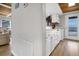 Simple kitchen with white cabinets, ocean view, and access to hallway at 144 Palmetto Blvd, Edisto Island, SC 29438