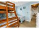 Bedroom with twin and full beds and access to another room at 144 Palmetto Blvd, Edisto Island, SC 29438