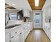 Modern white kitchen with ocean view and stainless steel appliances at 144 Palmetto Blvd, Edisto Island, SC 29438