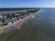 Wide shot of beachfront homes and coastline at 144 Palmetto Blvd, Edisto Island, SC 29438