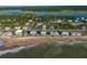Aerial view of beachfront property and surrounding neighborhood at 144 Palmetto Blvd, Edisto Island, SC 29438