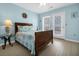 Bedroom with queen bed and ocean view at 144 Palmetto Blvd, Edisto Island, SC 29438