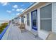 Oceanfront deck with seating and beach views at 144 Palmetto Blvd, Edisto Island, SC 29438