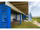 Covered ground level deck with outdoor shower and grill at 144 Palmetto Blvd, Edisto Island, SC 29438