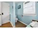 Small bathroom with toilet and window at 144 Palmetto Blvd, Edisto Island, SC 29438