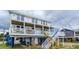 Elevated beach house with multiple levels and balconies at 144 Palmetto Blvd, Edisto Island, SC 29438