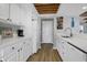 White kitchen with stainless steel appliances and ocean views at 144 Palmetto Blvd, Edisto Island, SC 29438