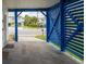 Covered parking with blue slatted fence at 144 Palmetto Blvd, Edisto Island, SC 29438